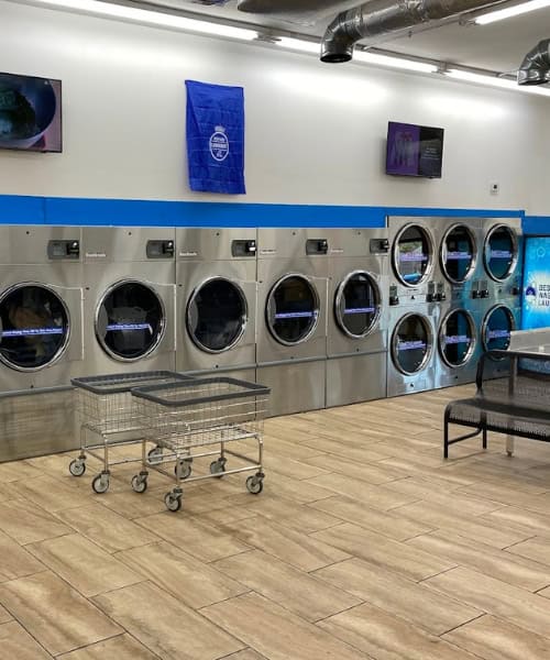 Best Wash Laundromats — Fairview location interior showing large modern washers