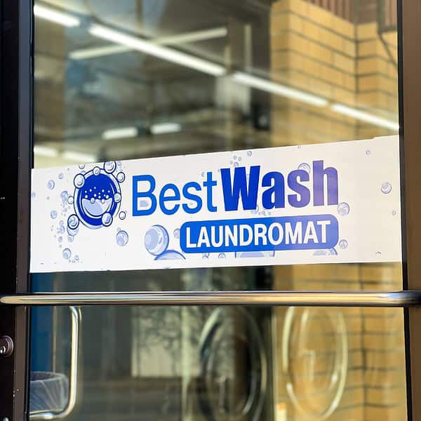 an image of Best Wash Laundromats sign in Overland Laundromat in Woodson Road location